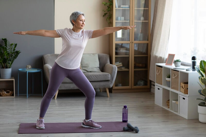 senior woman working out at home