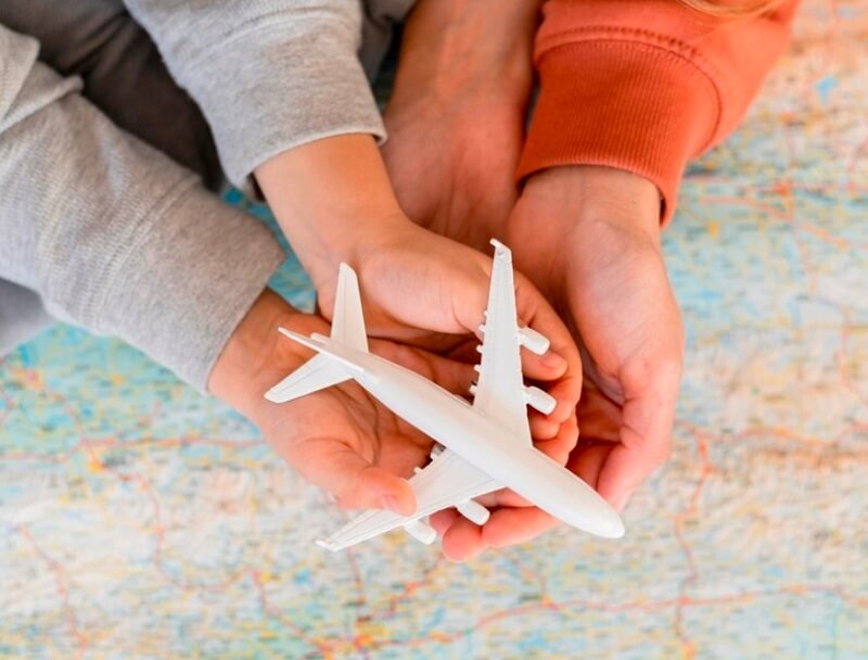 toy airplane in hands